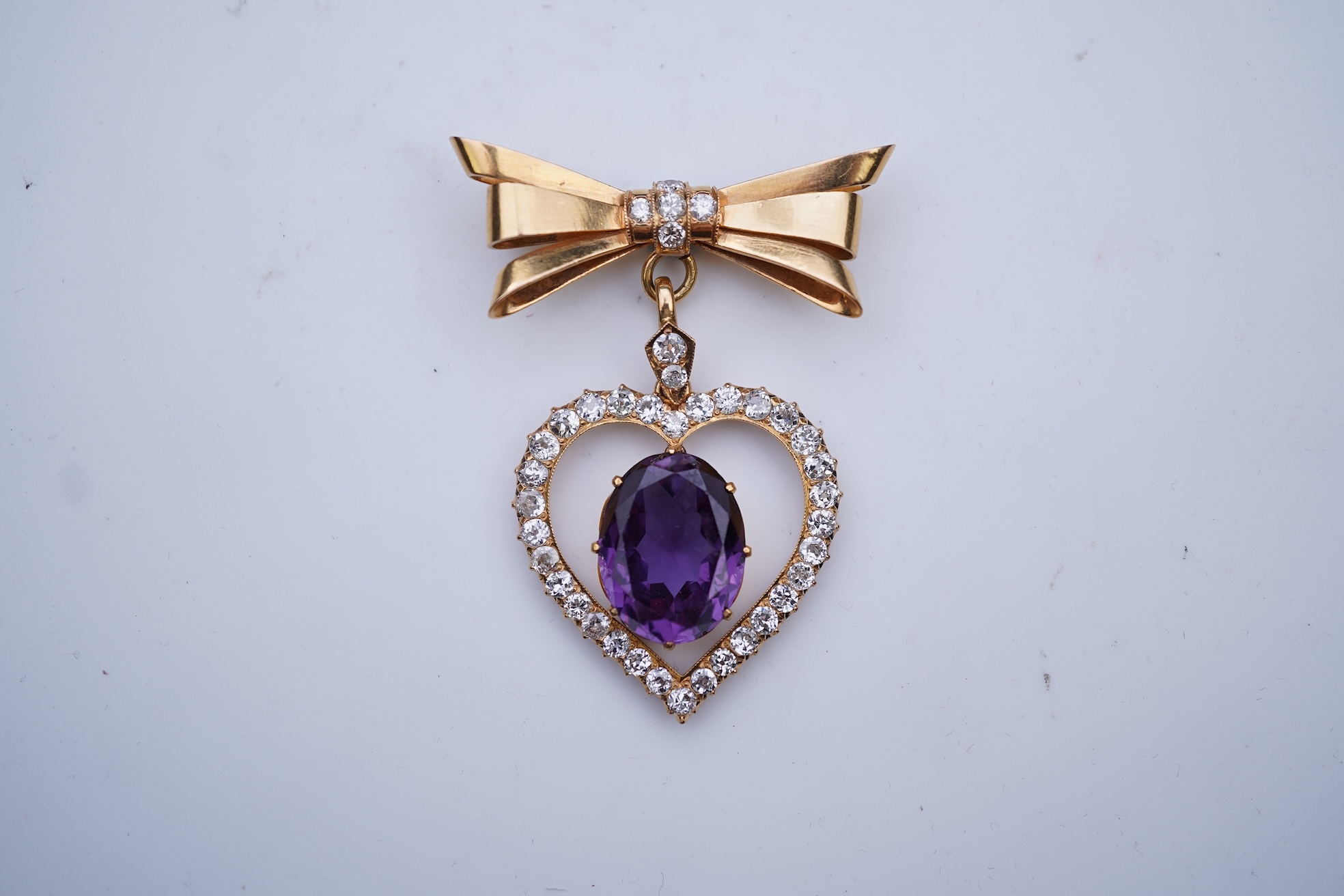 A synthetic sapphire and diamond pendant, mid 20th century